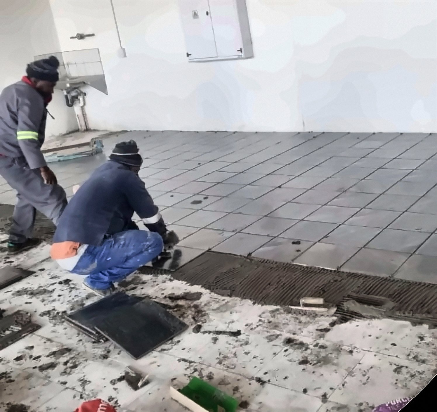 Floor tiling in progress