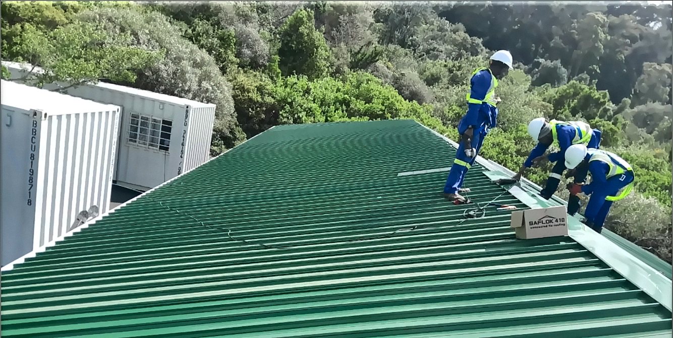 TLM team installing green roof sheeting at SANBI